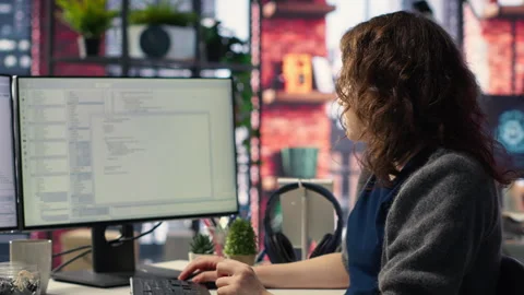 Female programmer developing app and software algorithm on pc Stock Footage 308672447