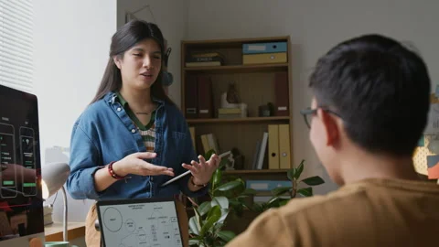 Female Programmer Having Conversation with Colleague Stock Footage 317340912