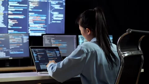 Female Programmer Having Headache Writing Code Laptop Using Multiple Monitors Stock Footage 244424146
