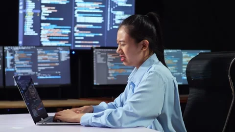 Female Programmer Having Headache   Writing Code  Laptop Using Multiple Monitors Video stock 244426500