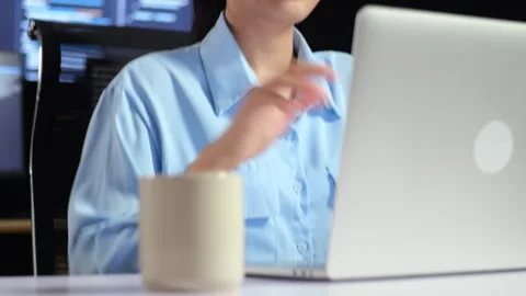 Female Programmer Having A Meeting Laptop While Code On Multiple Monitors Stock Footage 244421829