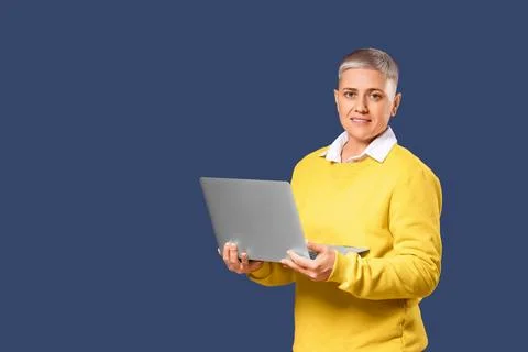 Female programmer with laptop on blue background Stock Photos