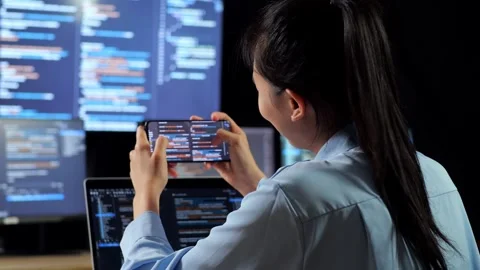 Female Programmer Look Database Smartphone Code Laptop Using Multiple Monitors Stock Footage 244425345