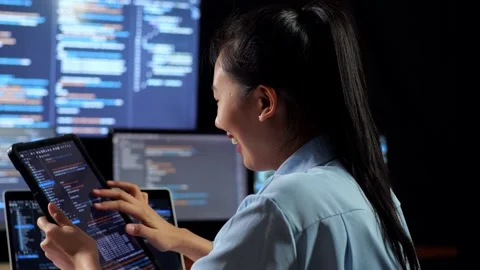 Female Programmer Look Database On Tablet Writing Code Laptop Multiple Monitors Stock Footage 244425740