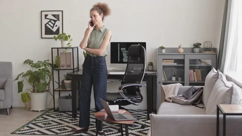 Female Programmer Making Phone Call during Work from Home Stock Footage 171534806