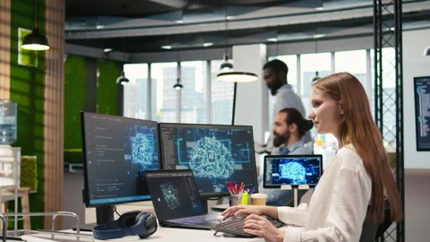 Female programmer in office integrating AI machine learning systems Video stock 313165941