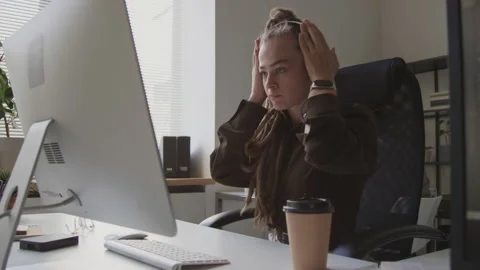 Female Programmer Putting on Wireless Headphones at Workplace Stock Footage 255782186