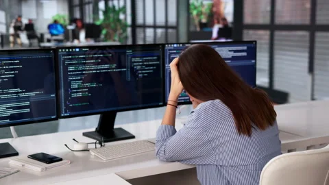 Female Programmer Sits At Desk, Feeling Bored Stock-Footage 334523652