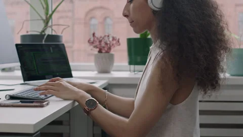 Female Programmer Sitting on Fit Ball and Coding on Computer in Office Stock Footage 274340272