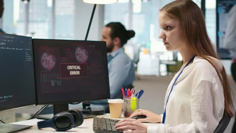 Female programmer in startup office struggling to fix application errors Stock-Footage 313015558