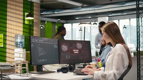 Female programmer in startup office struggling to fix application errors 動画素材 313165351