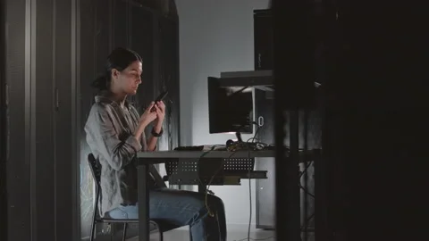 Female Programmer Talking on Cellphone Stock-Footage 162458834