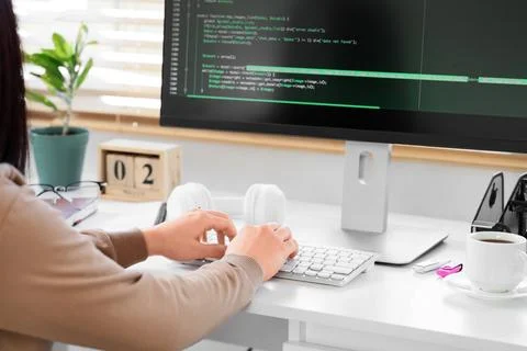 Female programmer testing code on computer in office Foto stock