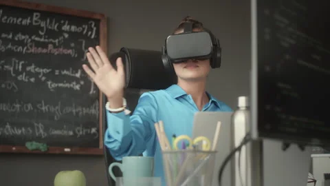 Female Programmer Testing New App in VR Headset Stock Footage 263700694