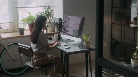 Female Programmer Typing on Desktop Computer in Office Stock Footage 306206658