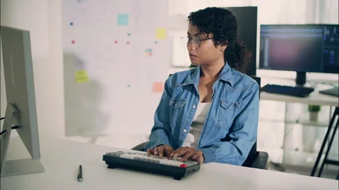 Female programmer typing on laptop while working with AI and computer. Stock Footage 319001673