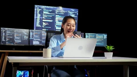 Female Programmer Using Smartphone While Writing Code Laptop Multiple Monitors Stock Footage 244423138