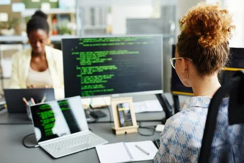 Female programmer working with codes on computer 스톡 사진