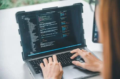 Female programmer working on coding, software development and web design.Co.. Stock Photos