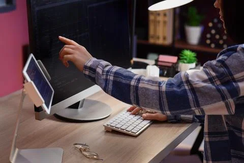 Female programmer working with computer at table in office 스톡 사진