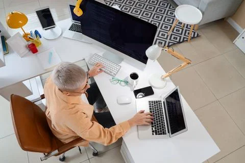 Female programmer working at desk in office, top view Stock-Fotos