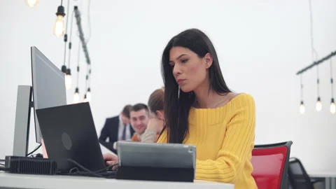 Female programmer working on new project. Hispanic developer businesswoman at Stock Footage 236498207