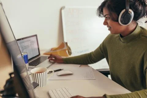 Female programmer working in office Stock Photos