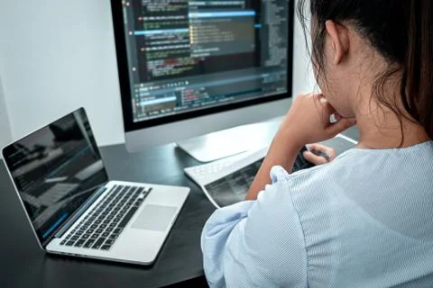 Female Programmer working in software javascript computer in IT office, Writi Stock Photos