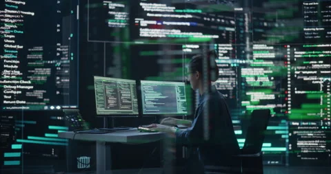 Female Programmer Writing Code Surrounded by Big Screens Video stock 243285594
