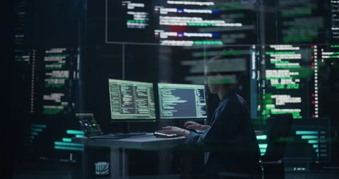 Female Programmer Writing Code Surrounded by Big Screens Stock Footage 243285704