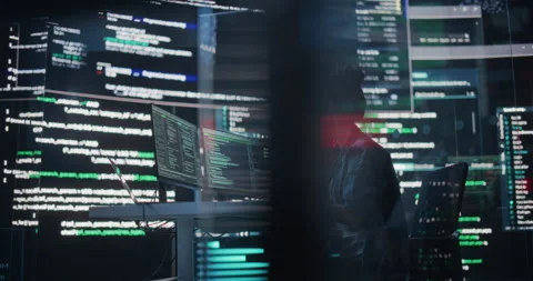 Female Programmer Writing Code Surrounded by Big Screens Video stock 243286076