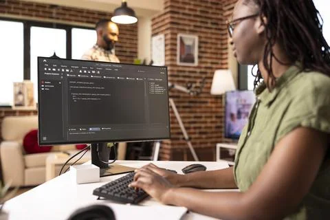 Female programmer writing website code at home Stock Photos