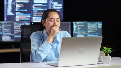 Female Programmer Yawning And Sleeping While Code Laptop Using Multiple Monitors Stock Footage 244421609
