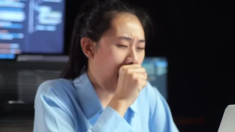 Female Programmer Yawning Sleeping While Writing Code Laptop Multiple Monitors Stock Footage 244422856