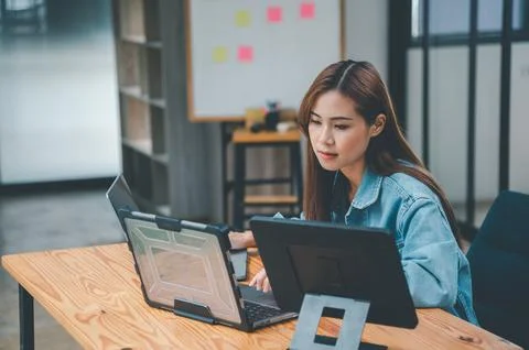 Female programmers are thinking and planning to work on programming, softwa.. Stock Photos