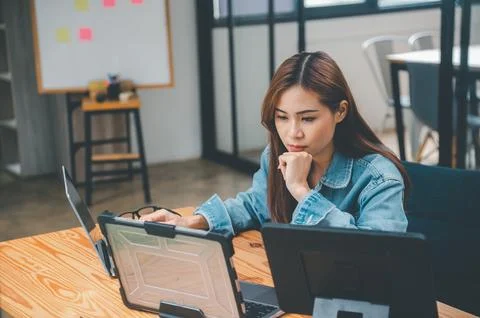 Female programmers are thinking and planning to work on programming, softwa.. Stock Photos