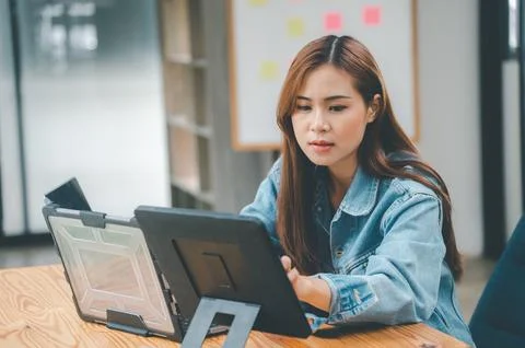 Female programmers are thinking and planning to work on programming, softwa.. Stock Photos