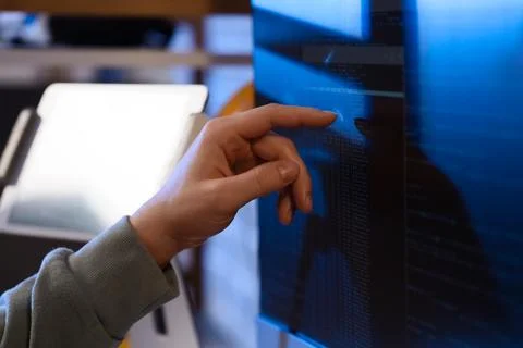 Female programmers hand testing code on computer in office at night, closeup Stock-Fotos