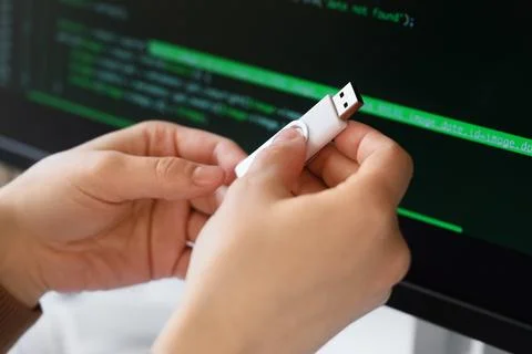 Female programmers hands with USB flash drive in office, closeup 스톡 사진