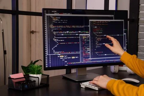 Female programmers hands working with computer at table in office 스톡 사진