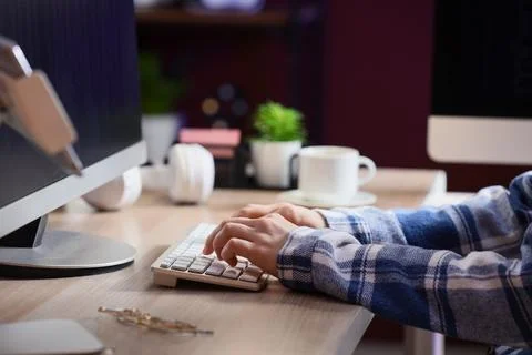 Female programmer's hands working with computer on table in office, closeup 스톡 사진