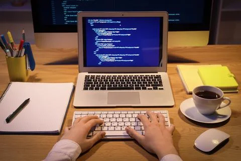 Female programmer's hands working in office at night Stock-Fotos