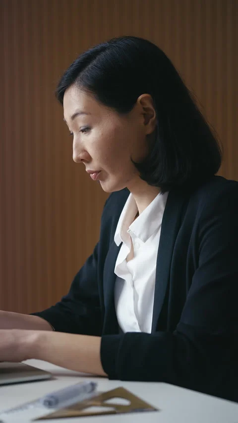 Female property developer works on laptop, managing real estate projects Stock Footage 302469683