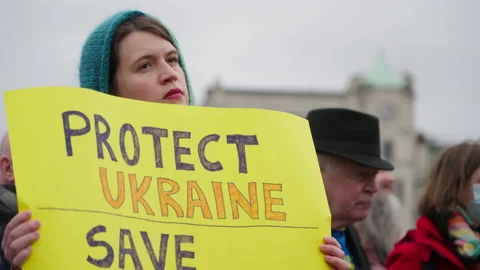 Female Protestor Protect Ukraine Banner London UK Demonstration Trafalgar Square Stock Footage