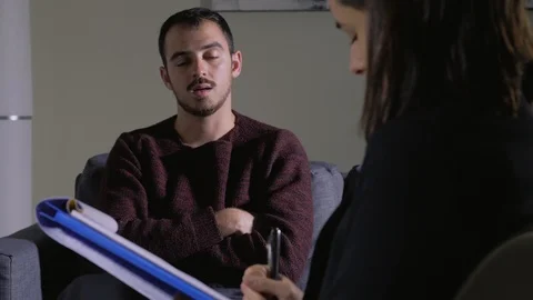 Female Psychologist Making Notes during Therapy Session with upset patient 스톡 동영상 104976324