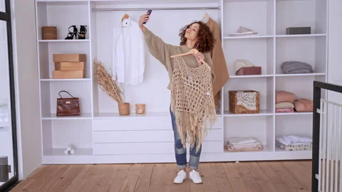 Female putting on clothes Stock Footage 170333256