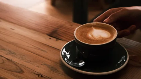 Female putting down cup of coffee in slow motion, Lisbon, Portugal, HD Stock Footage 150746767