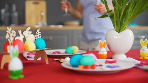 Female Putting Wineglasses on Easter Table Stock Footage 124473354
