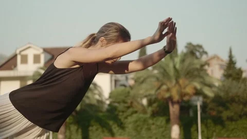 Female qigong master practicing breathing and movement exercises Stock Footage 257669642