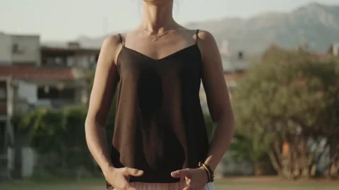 Female qigong master practicing breathing and movement exercises Stock Footage 257669853